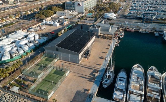 Aerial view of the marina with the sports courts next to the berths