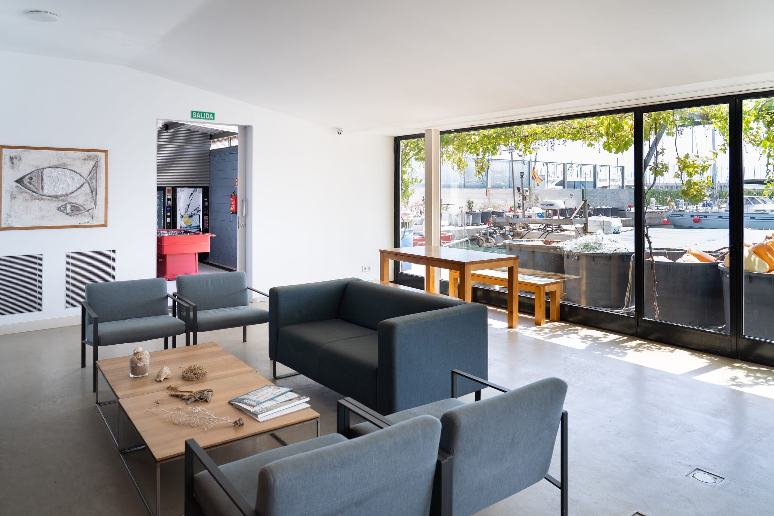 Crew Club lounge with sofas and large windows overlooking the harbour